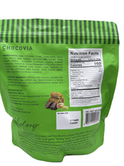 CHOCOVIA Dubai Style Milk Chocolate close-up on pistachios highlights nuttiness and texture.