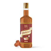 ChocZero hazelnut syrup bottle pour highlights zero sugar and rich nutty flavor for coffee