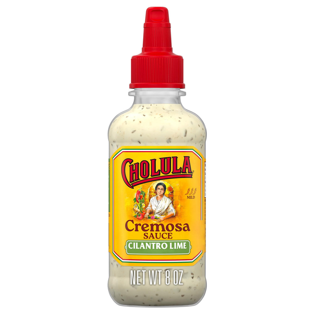 Cholula Cremosa Cilantro Lime bottle pour on tacos for creamy tang.