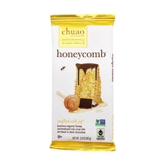 Chuao Chocolatier dark honeycomb bar unwrapped, glossy chocolate with amber honey crystals, snack-ready.