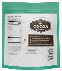 Cocoa Classics Mint Cocoa Mix being stirred into a creamy mug