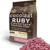 Cocoläat Ruby couverture chips in gold foil pouch ready for fresh baking.