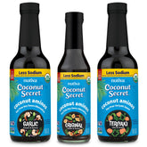 Coconut Secret Original 8oz bottle pour showing soy-free, low-sodium umami for stir-fries