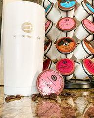 Coffee Beanery Amaretto pods in a brew-setup, compatible with K-Cup brewers.