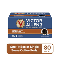 Hazelnut coffee cup steaming beside Victor Allen's hazelnut pods