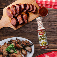 Colgin liquid smoke drops on steak deliver savory depth and aroma.