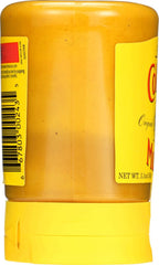 Colman's Mustard close-up texture highlighting smooth, pungent flavor.
