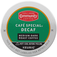 Community Coffee Café Special Decaf K-Cup Pod in a mug releasing rich aroma.
