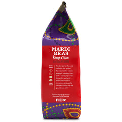 Community Coffee Mardi Gras King Cake cup steaming after brewing, showcasing inviting vanilla aroma.