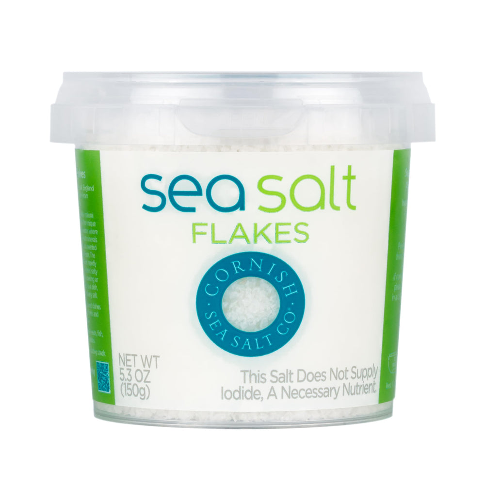 Cornish Sea Salt Co mineral flakes tub front for finishing salt with delicate crunch and flavor lift.