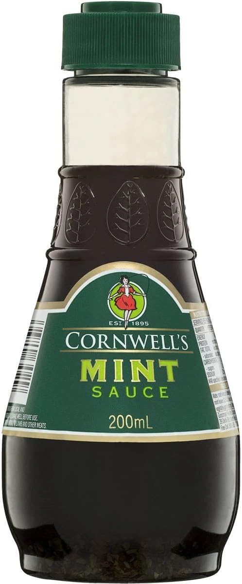 Cornwells Mint Sauce bottle being poured over lamb for a savory mint glaze.