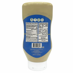 Cortas Tahini squeeze bottle pour highlighting creamy texture for sauces and baking.
