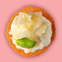 Craize Guava Crisps served with cheese on a charcuterie board.