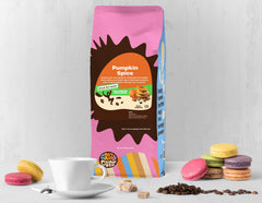 Close-up of Crazy Cups decaf pumpkin spice grounds releasing rich aroma.