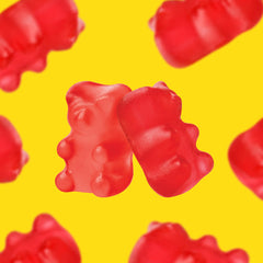 CrazyOutlet Cinnamon Bears red gummies illuminate spicy bite in party bowls.