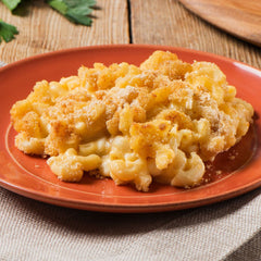 Creamette elbow macaroni in pasta salad bowl for texture and flavor.
