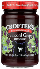 Crofters Organic Concord Grape Spread jar on kitchen counter, ideal for quick breakfasts.