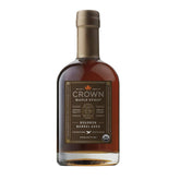 Crown Maple Bourbon Barrel Aged Syrup bottle highlighting rich maple notes for pancakes and glazes.