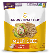 Crunchmaster roasted garlic multi-seed crackers 4 oz on a plate with savory crunch
