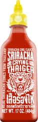 Crying Thaiger Sriracha bottle pouring to boost flavor in meals.