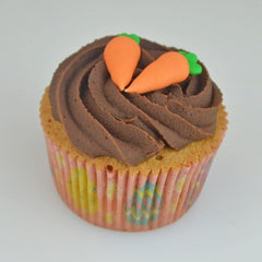 Culpitt carrot sugar pipings on cupcakes provide bright color and bite.