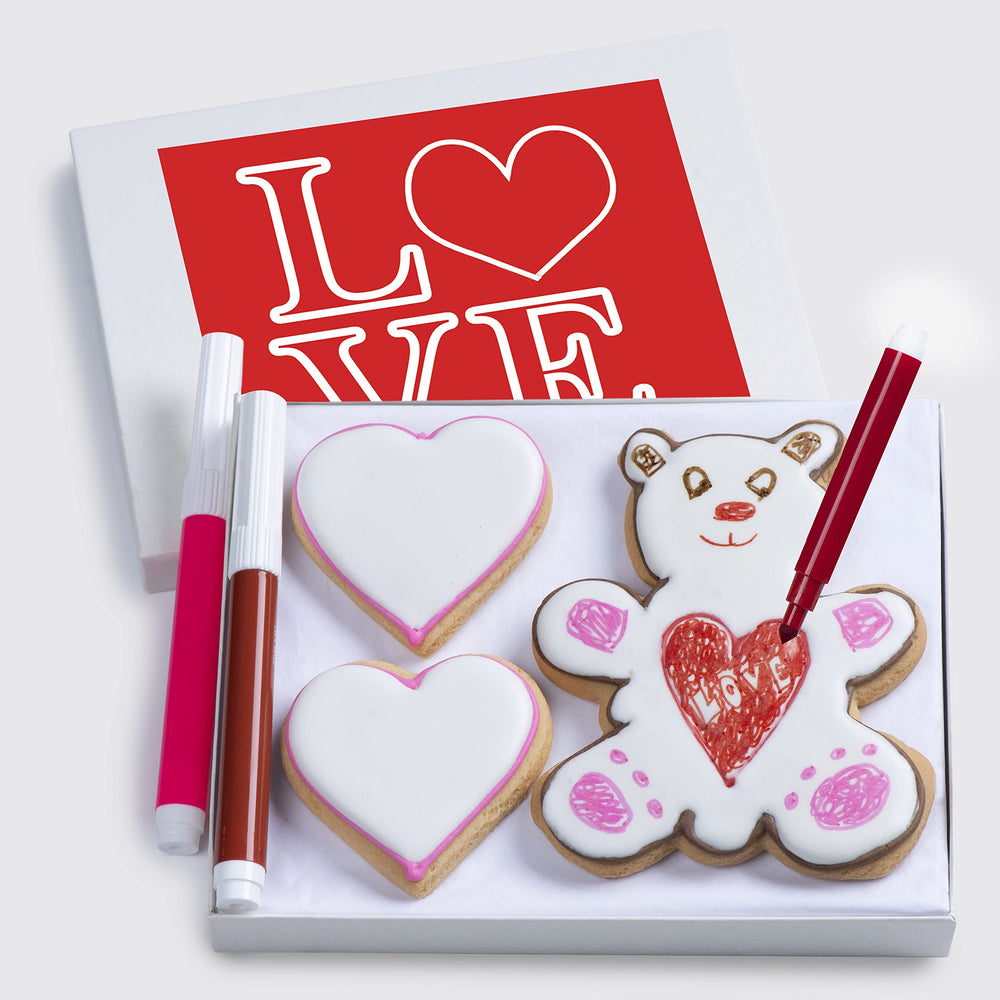Custom Cookies Valentines basket with hand-decorated cookies and edible markers for kids' decorating fun.