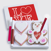 Custom Cookies Valentines basket with hand-decorated cookies and edible markers for kids' decorating fun.