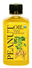 Daana Peanut Oil bottle on counter showcasing organic, cold-pressed quality for healthy cooking.