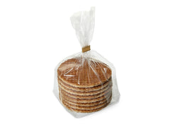 Daelmans Stroopwafels warming on cup, melts filling for cozy coffee rituals.