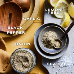 Dalkin & Co Lemon Pepper shaker dispensing seasoning onto dishes.