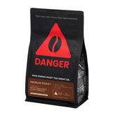 Danger Coffee ground bag shows clean, high-quality beans for a dependable morning brew.