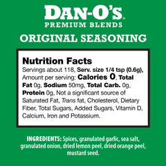 Pouring Dan-O's Seasoning from the bottle to boost grilling flavor.