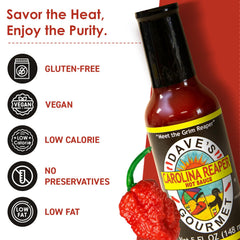 Dave's Gourmet Carolina Reaper Hot Sauce bottle spices up tacos with intense flavor.