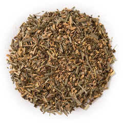 Davidson's Organics Ginger Spice loose leaf tea in a steaming cup, signaling warming flavor and aroma.