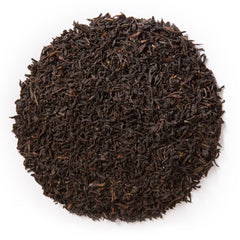Davidson's Russian Caravan loose leaves steeping in a mug with a delicate smoky aroma.