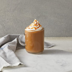 DaVinci Gourmet Classic Caramel Sauce swirled into hot cocoa for depth.