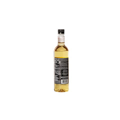 Pouring DaVinci Gourmet Classic Cheesecake Syrup over a beverage for sweetness.