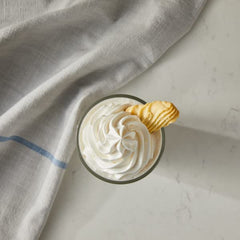 DaVinci Gourmet Vanilla Bean iced coffee finished drink cup showcases creamy texture.