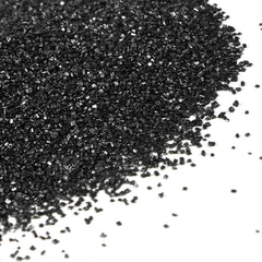 Dazzjoy black sanding sugar on a cake surface for dramatic decoration.