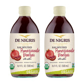 De Nigris Organic Pomegranate Vinegar bottle pouring over a fresh salad for bright flavor