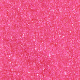 DecoPac Pink Sanding Sugar in a handheld jar adds sparkle to cakes