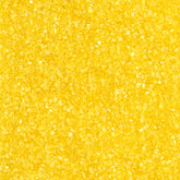DecoPac yellow sanding sugar in handheld container for quick decorating.