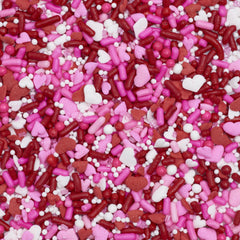 Closeup of DecoPac Valentine Fusion Sprinkles in red, pink, white mix for vibrant decor