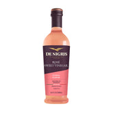 De Nigris Sweet Rosé Wine Vinegar bottle pour, ideal for fresh dressings.