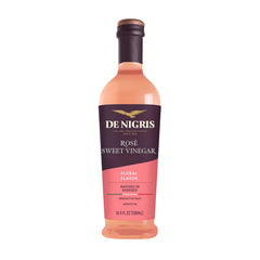 De Nigris Sweet Rosé Wine Vinegar bottle pour, ideal for fresh dressings.