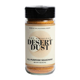 Desert Dust all-purpose seasoning jar close-up, smoky-earthy rub for grilling steaks.