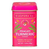 Diaspora Co Pragati turmeric in a bright floral tin delivering vibrant color and aroma.