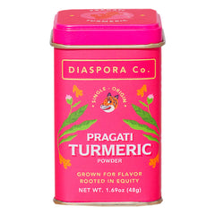 Diaspora Co Pragati turmeric in a bright floral tin delivering vibrant color and aroma.