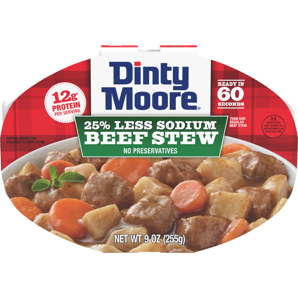 Dinty Moore less-sodium beef stew tray on shelf for quick meals.
