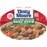 Dinty Moore less-sodium beef stew tray on shelf for quick meals.